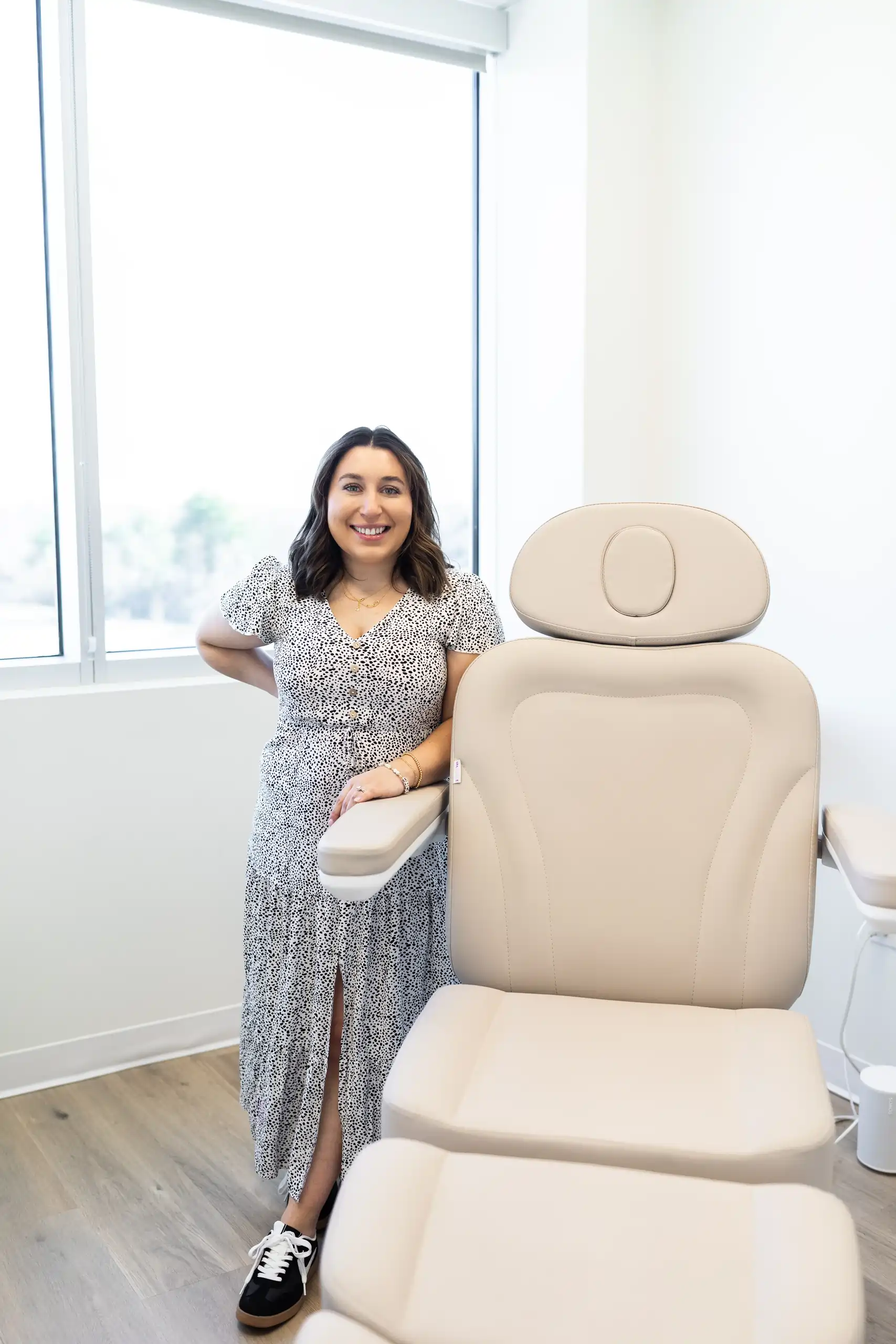 a woman standing next to a chair, morpheus8-aa-sunday-skin-aesthetics-brentwood-tn