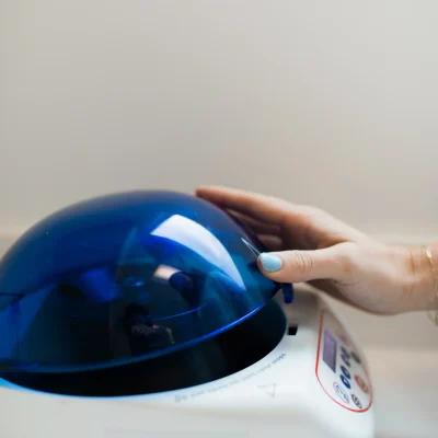 a hand holding a blue dome, PRF EZ Gel in Brentwood, TN