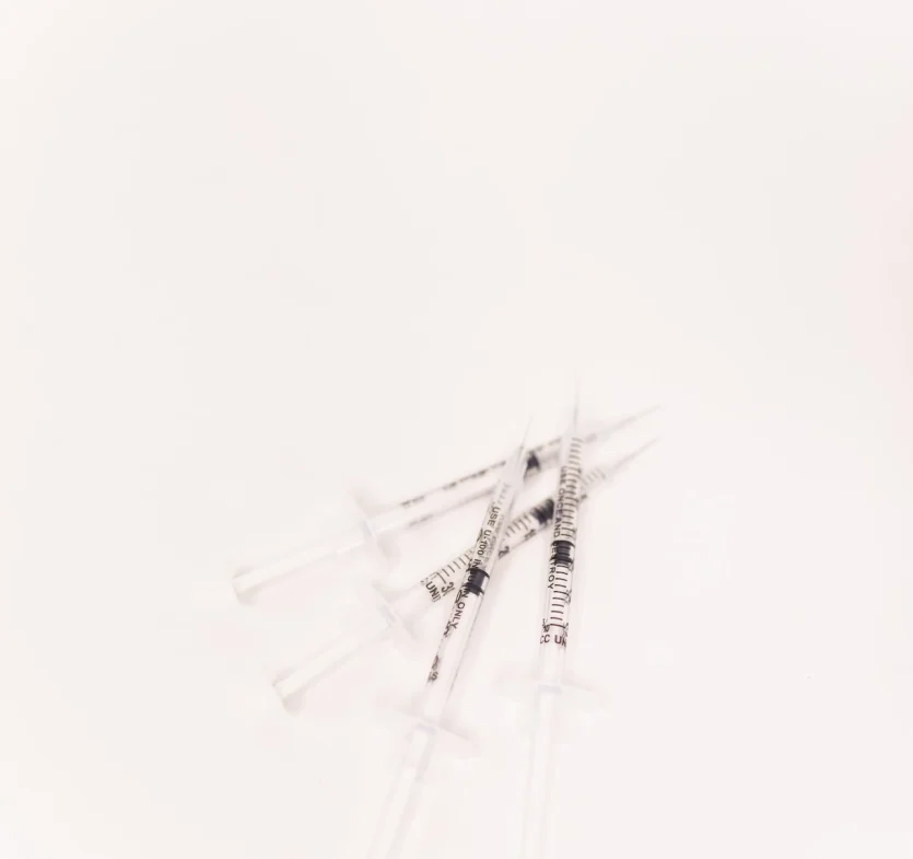 a group of syringes on a white background