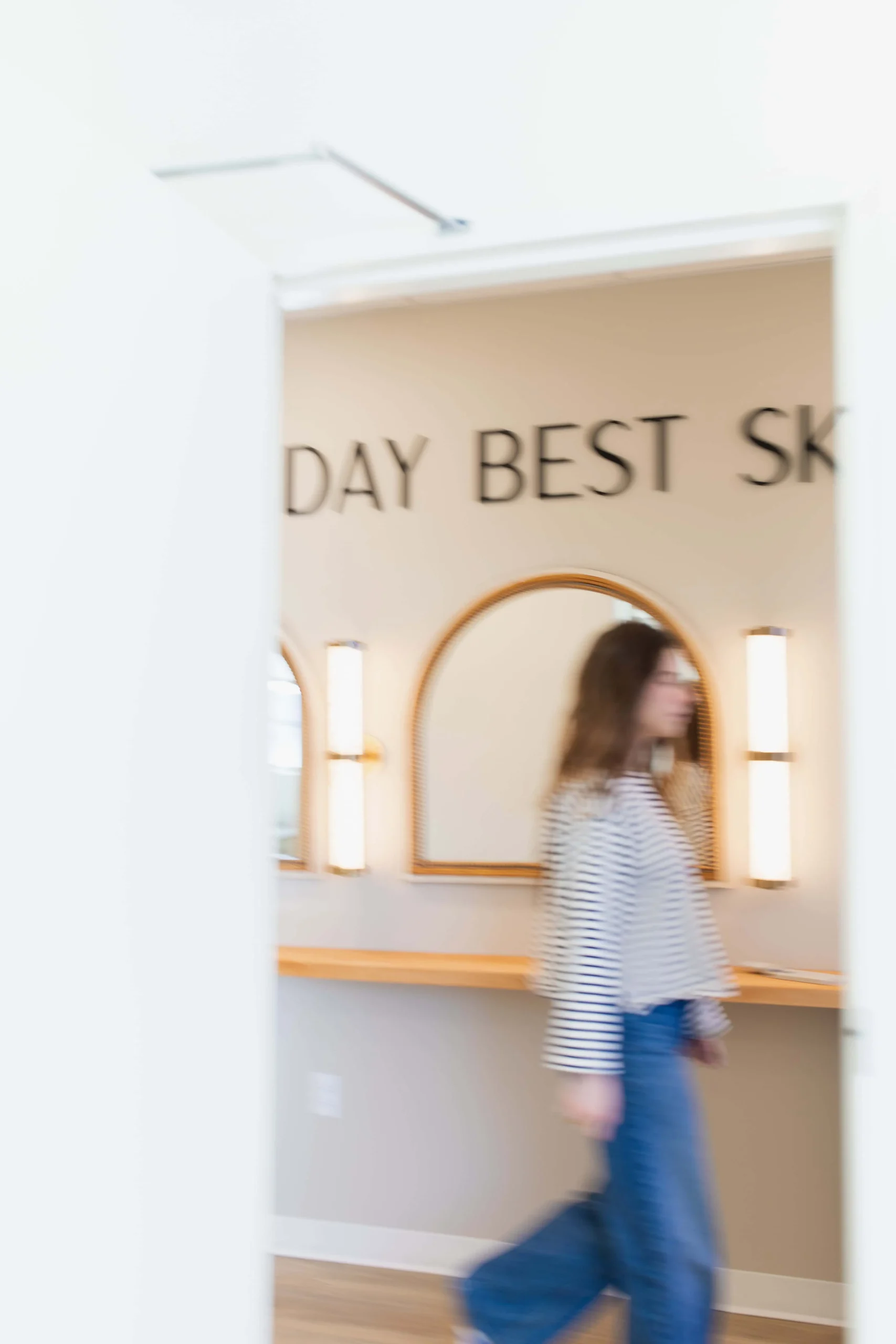 a blurry image of a woman walking in a hallway, new patients in Brentwood, TN